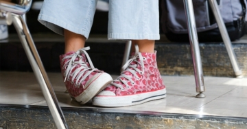 Braided legs of a little girl