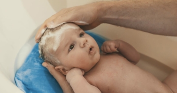 child whose body is washed during the bath