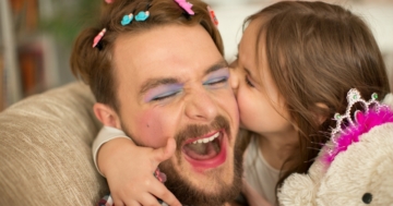 Dad is playing with daughter