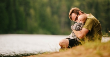 Child in his father's arms