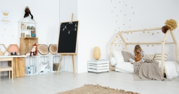 little girl playing in her montessori room