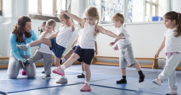 the children play sports with the teacher