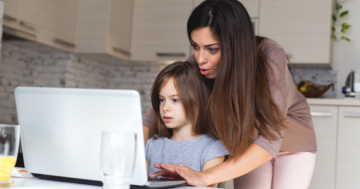 Mother explains to little girl how parental control works